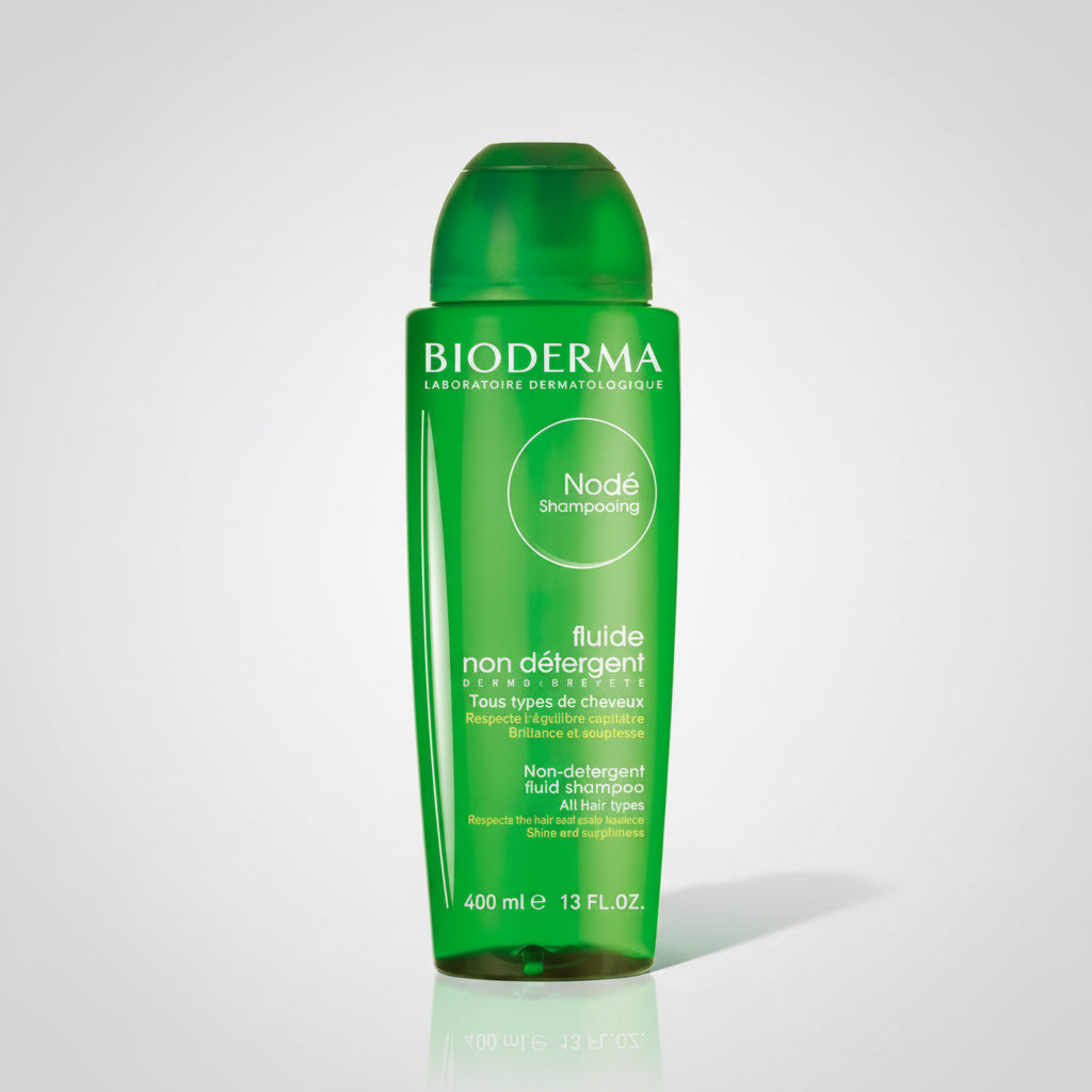Bottle of Bioderma Node Shampooing Fluid, 400ml, with a green label and cap.