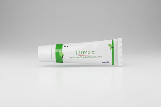 A white squeeze tube of ilumax Advanced Skin Lightning Cream with green leaf accents and branding, shown on a clean white background.