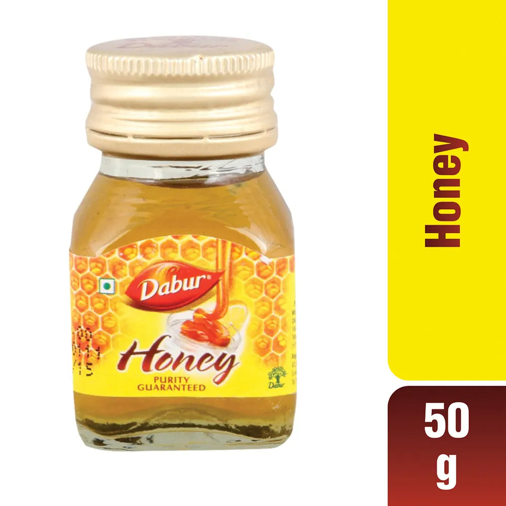 Dabur honey jar with a yellow label on a white background