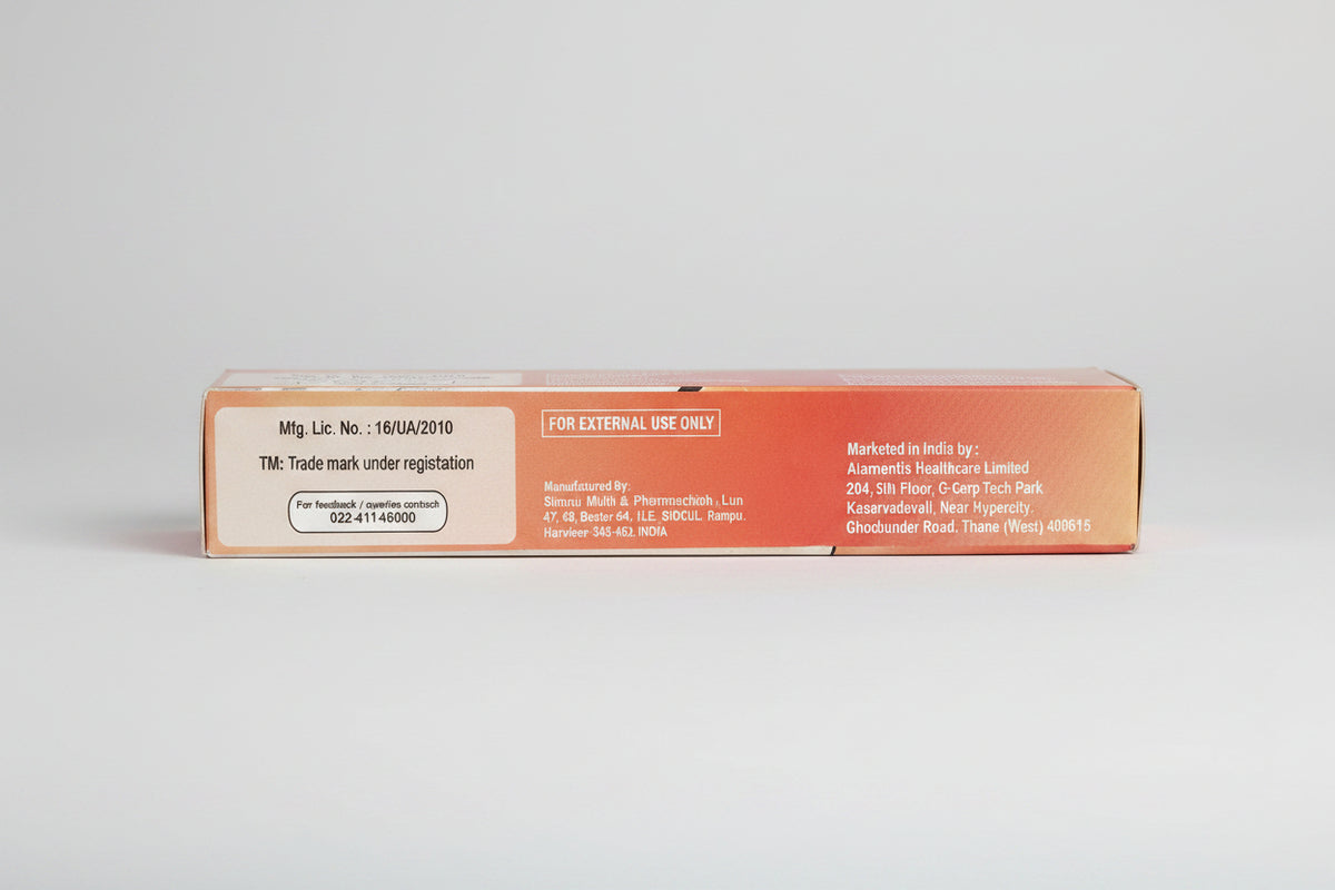 A close-up of the side of a pink medicine box showing printed text including 'FOR EXTERNAL USE ONLY', manufacturer details, and marketing information.