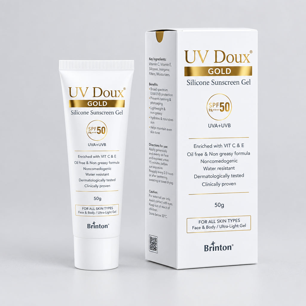 UV Doux Gold Sunscreen in a white tube and box, with text indicating SPF 50, dermatologically tested, and clay and granular technology.