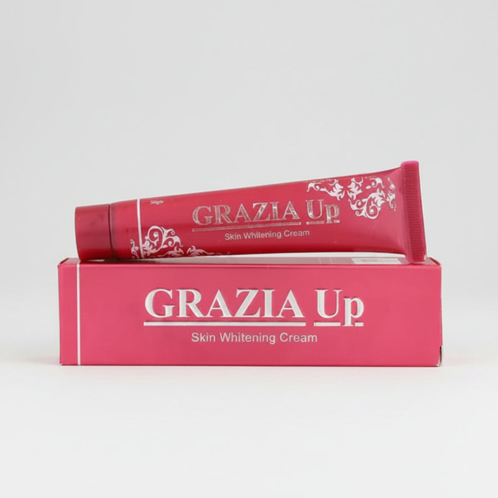 A tube of Grazia Up skin whitening cream with a pink floral pattern on the packaging, indicating the product is designed to brighten skin.