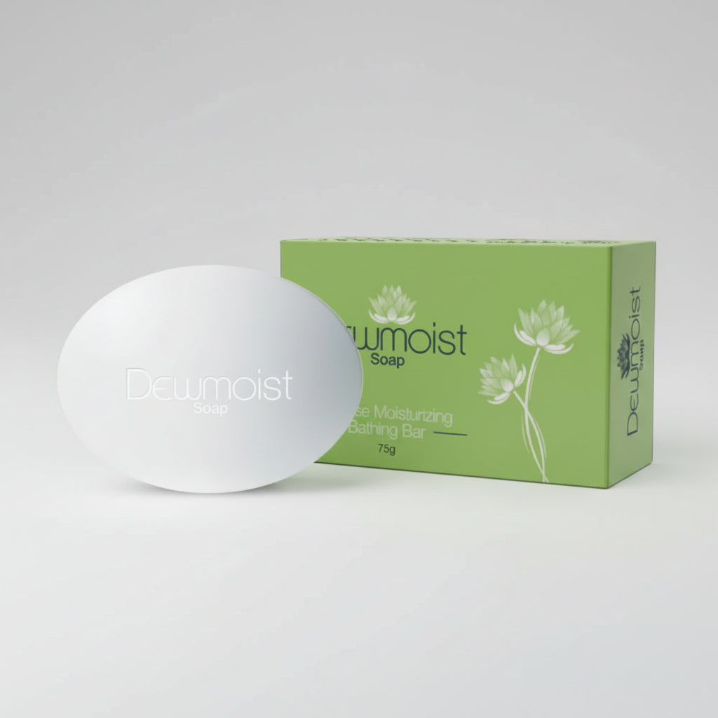 A bar of Dewmoist soap next to its packaging box, which has a green and white color scheme with floral designs and the brand name.