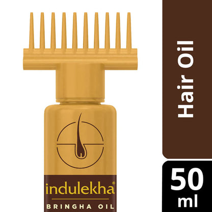 Indulekha Bringha Oil bottle with comb on a white background