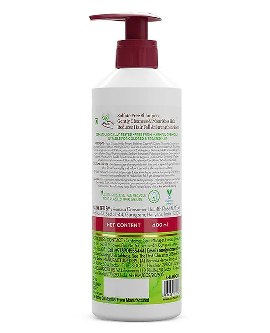 Bottle of shampoo with a pump on a white background
