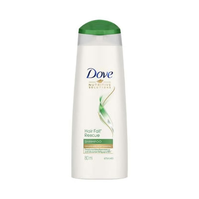 Dove shampoo bottle with green cap on a white background