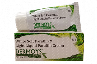 Box of Dermoys White Soft Paraffin & Light Liquid Paraffin Cream on a textured black and white background