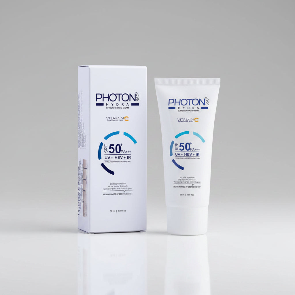 PHOTON Hydra Vitamin C Sunscreen Fluid Cream shown with its white and blue retail box and a matching white squeeze tube on a clean white background.