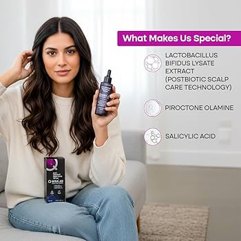 A woman sitting on a sofa holds a bottle of Scalp & Hair Care Serum, with another box in her lap. The image includes a text overlay on the right titled 'What Makes Us Special?' listing ingredients like Lactobacillus Bifidus Lysate Extract and Piroctone Olamine.