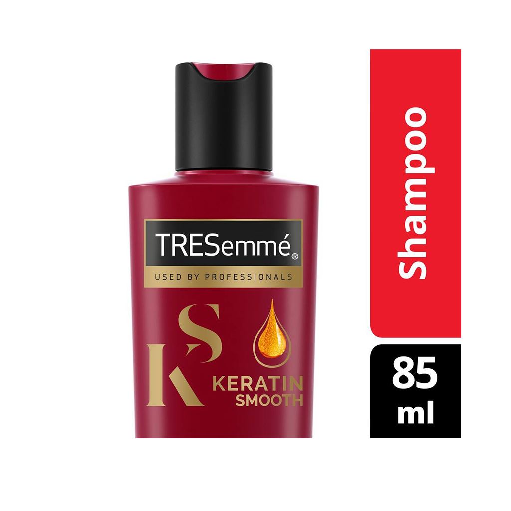 TRESemmé shampoo bottle with red label and black cap on a white background
