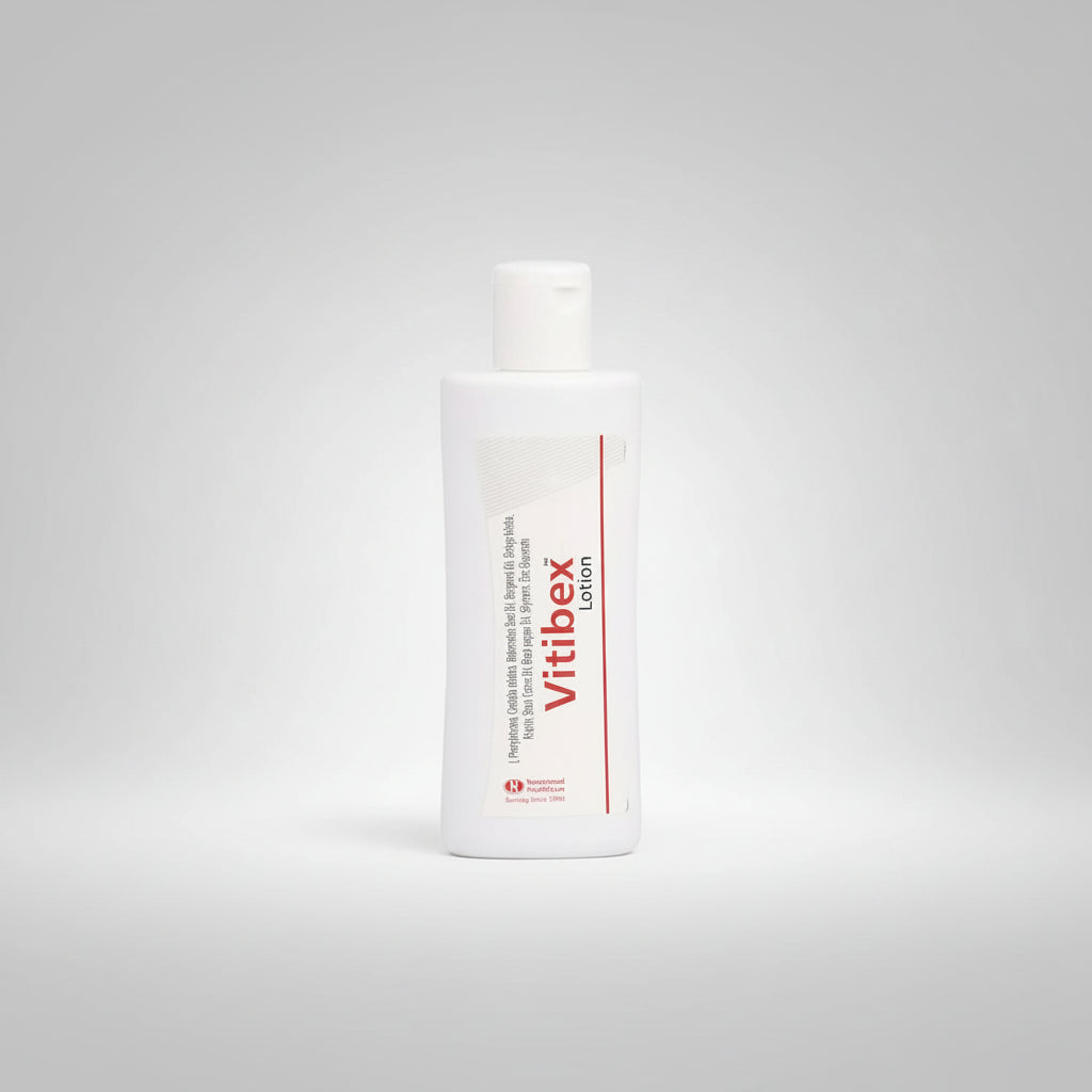 A white plastic bottle of Vitibex Lotion with a white cap, featuring a white label with red and black text, on a plain white background.