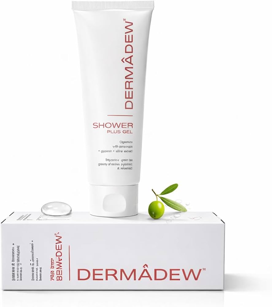 Dermàdew Shower Plus Gel in a white squeeze tube, displayed on top of its white retail box with a small clear gel droplet and a green olive branch prop, against a clean white background.