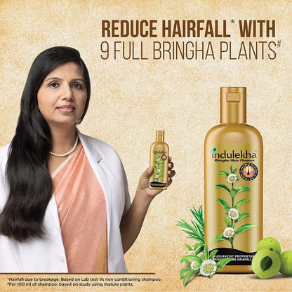Woman holding Indulekha hair care product with text on a beige background