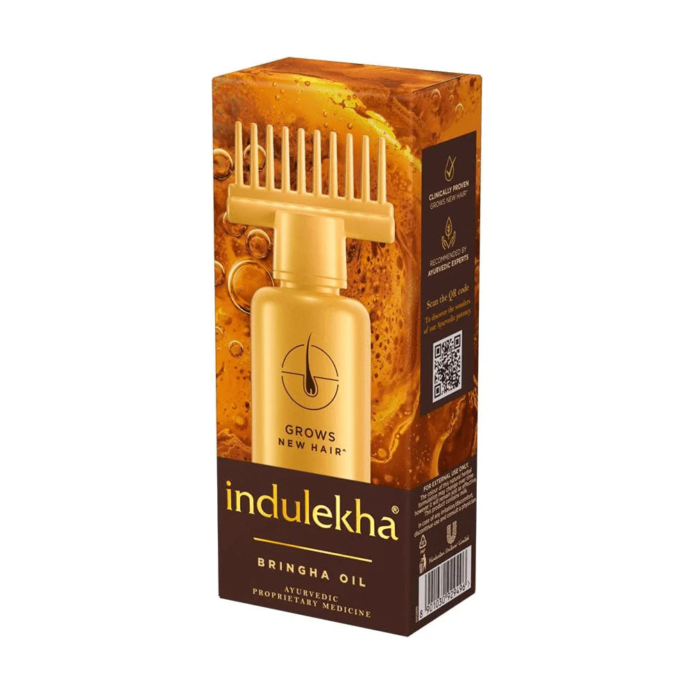 Indulekha Bringha Oil packaging with bottle and comb on a white background