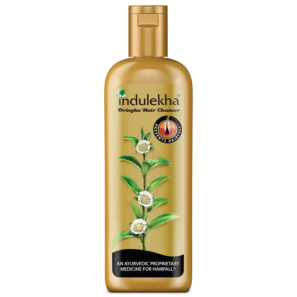 Indulekha hair cleanser bottle with gold cap and label on a white background