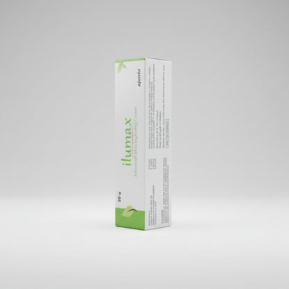 The image shows the packaging of Ilumax Cream, 20gm. The box is primarily white with green and lime green accents, and it contains text detailing the product name, dosage, and instructions.